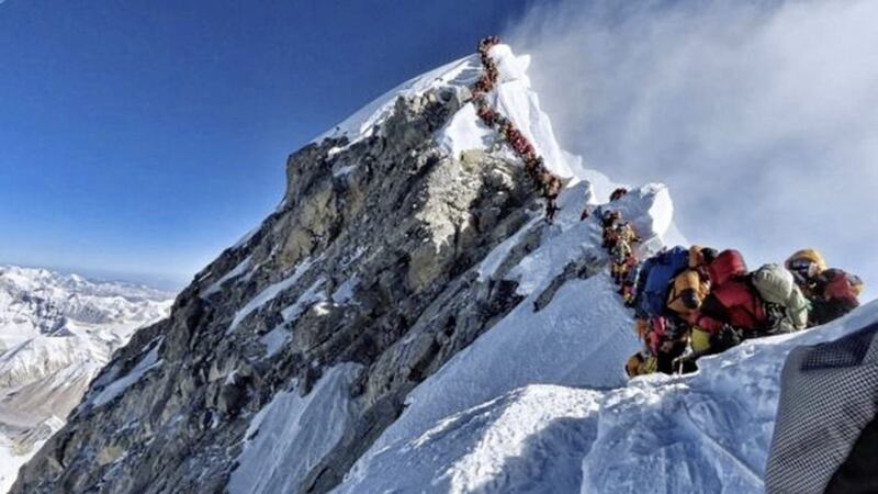 A photo has emerged showing a long line of climbers queuing on Mount Everest to ascend the summit 