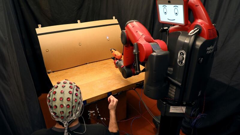 Researchers have designed a system that allows machines to use a person’s brainwaves and hand gestures to do tasks.