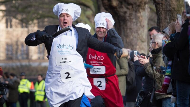 Just some pictures of politicians running and flipping pancakes because it's Pancake Day