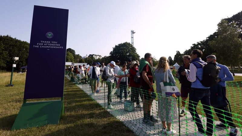 Tennis fans in the Wimbledon queue on day one of the 2023 Wimbledon Championships (Steven Paston/PA)