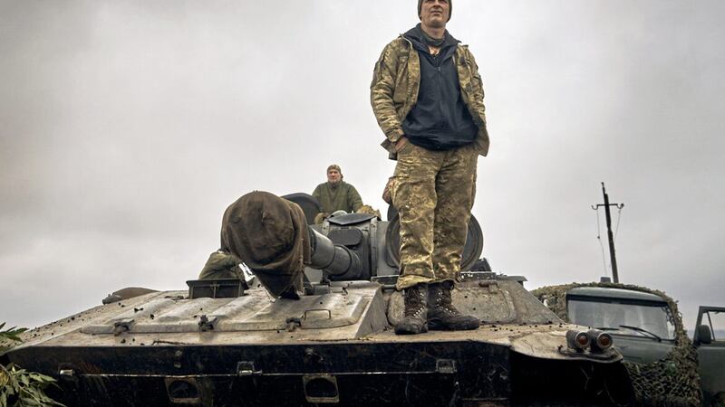 A Ukrainian soldier stands on a tank in the freed territory of the Kharkiv region on Monday (AP Photo/Kostiantyn Liberov). 