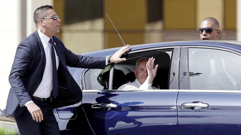 Pope Francis waves from the window of his car as he leaves Cairo&#39;s airport. Picture by Gregorio Borgia, Associated Press 