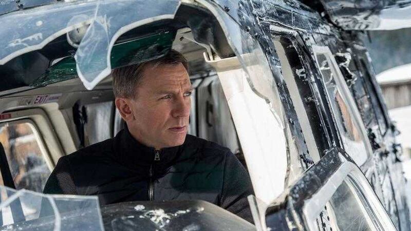 Daniel Craig struts and swaggers through the melee as James Bond in Spectre 