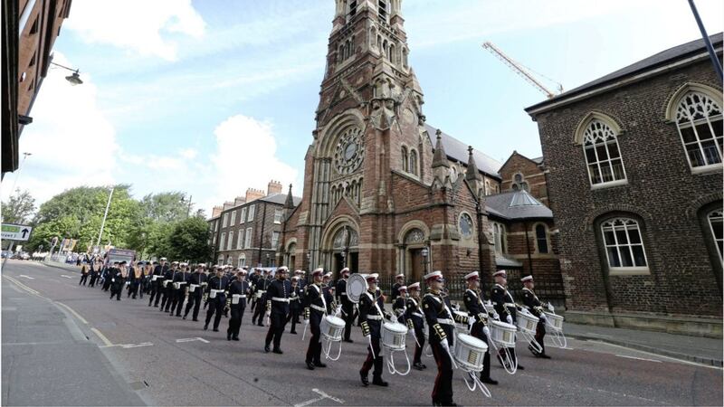 &nbsp;Orange bands passed St Patrick's Church on Donegall St with just a single drum beat. Picture: Hugh Russell.