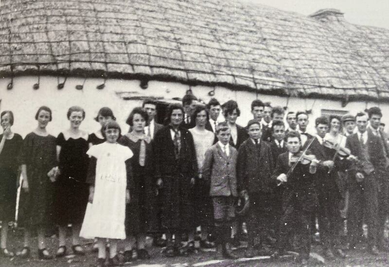 Rockwell Kent's photo which triggered Christy Gillespie's thirst for knowledge of Glenlough and its history. The 'Big Night' in honour of Rockwell was hosted by Danis McGinley at his cottage. Christy's grandmother is in the middle of the group wearing a light coloured jumper. 