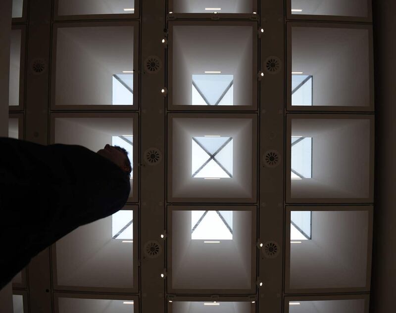 A visitor walks under the new glass pyramid roof at the Hayward Gallery (Kirsty O'Connor/PA)