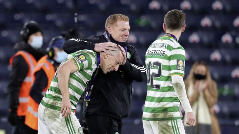 Celtic manager Neil Lennon with Scott Brown (left) as they celebrate victory over Hearts in the Scottish Cup Final at Hampden Park, Glasgow on Sunday December 20, 2020. Picture by Andrew Milligan/PA Wire. 