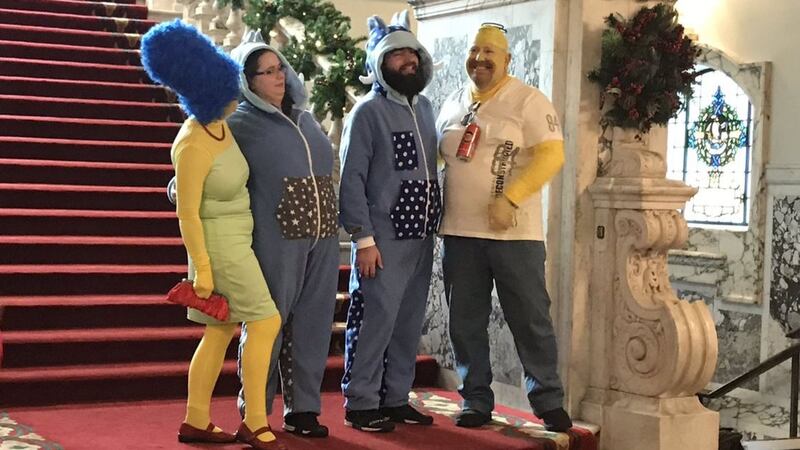 Revellers dressed as animals, Simpsons characters and dinosaurs mingled with senior diplomats at City Hall.