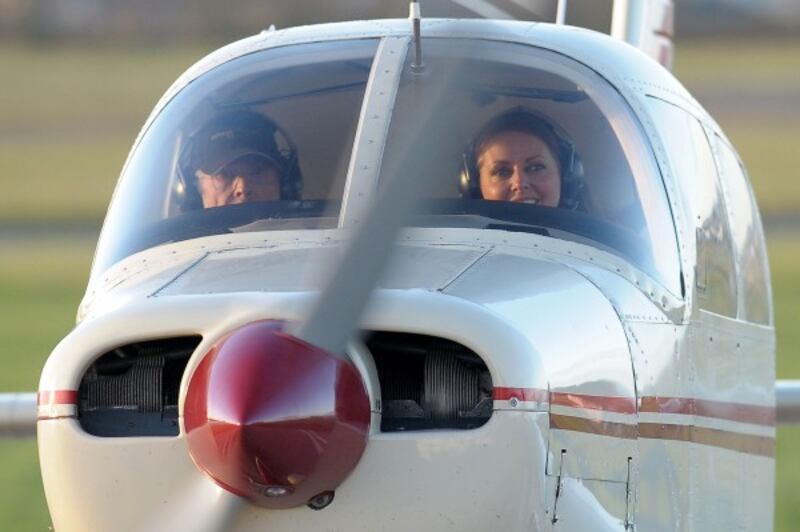 Carol Vorderman with flight examiner Bill Tollett at the Staverton Flying School at Gloucester Airport after passing her private pilot's licence (PPL) test.
