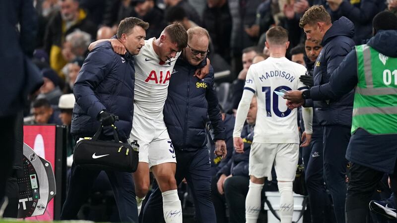 Tottenham’s Micky van de Ven and James Maddison go off injured (John Walton/PA)