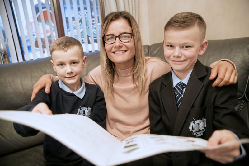 Kirsty Beggs with sons Robert (11), pictured right, and Zach (8). Both boys are being supported with language difficulties at Thornfield House School in Newtownabbey. Picture by Hugh Russell 