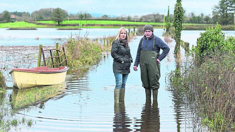 UNDER WATER: Agriculture minister Michelle O&#39;Neill with farmer Jimmy Maguire viewing the impact of flooding near Lisnaskea, Co Fermanagh in January 