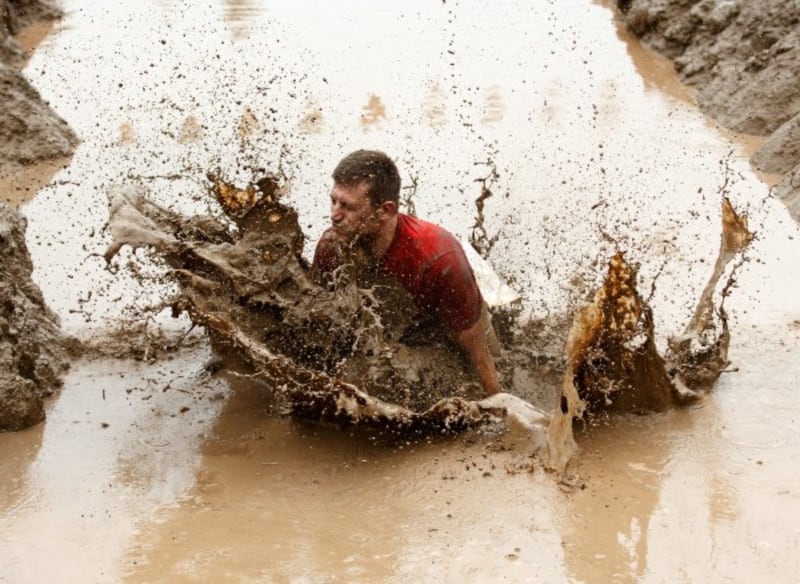 Participants take part in a Tough Mudder event race at Drumlanrig Castle