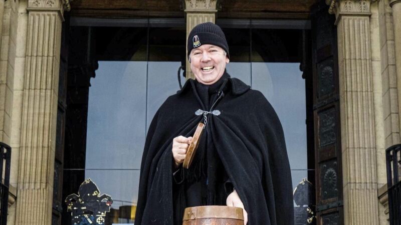 The Very Reverend Stephen Forde in his Black Santa garb outside St Anne&#39;s Cathedral. Picture by Elaine Hill Photography 