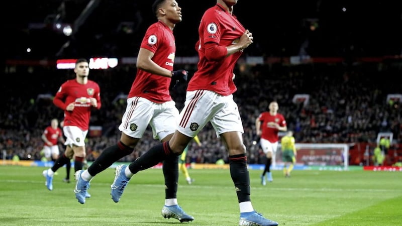 Manchester United&#39;s Marcus Rashford celebrates scoring his side&#39;s second goal of the Premier League game with Norwich on Saturday. United stay at the top of the Deloitte Football Money League, but could come under threat next year from Manchester City or Liverpool 