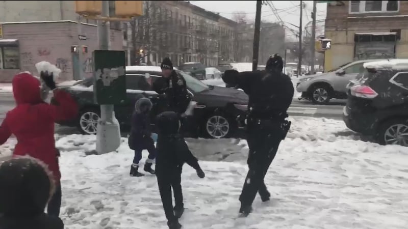 The officers were set upon by snowball-wielding children.