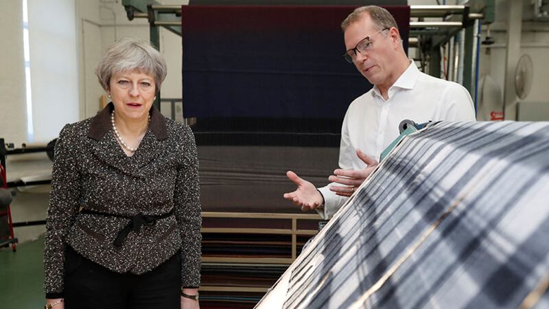 British Prime Minister Theresa May visits textile producers Alex Begg in Ayrshire, Scotland during a tour around the UK one year before Brexit&nbsp;