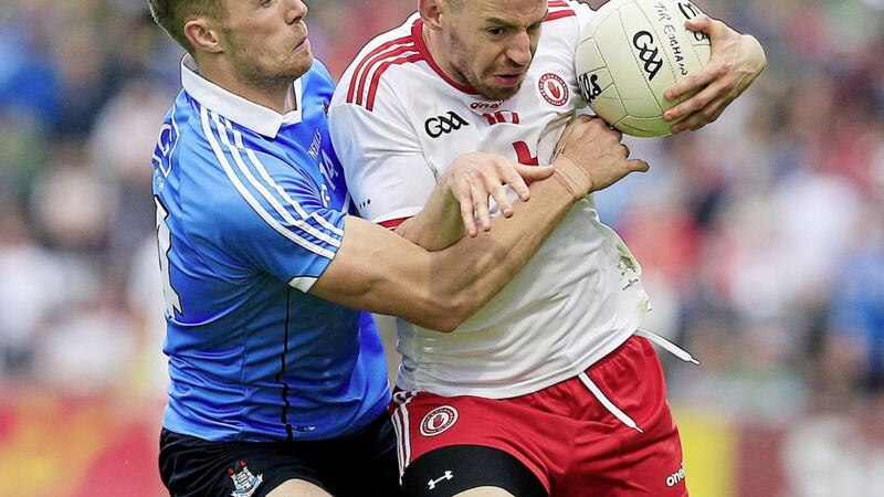 Dublin Paul Mannion moves in to tackle Tyrone&#39;s Mattie Donnelly 