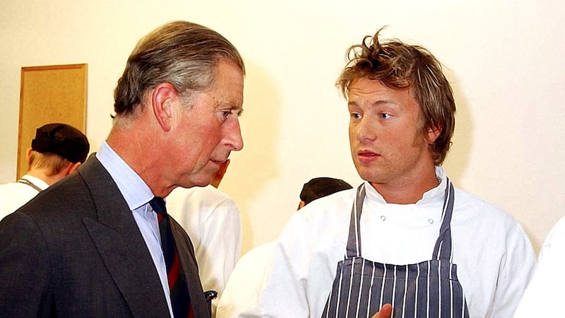 Charles talks to Jamie Oliver in the kitchen of Clarence House in 2003
