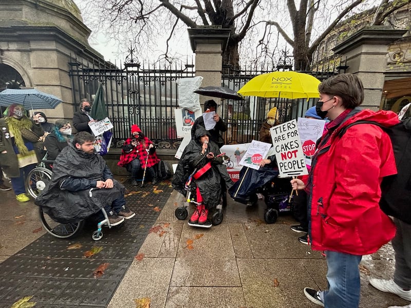 Disability groups protest outside Leinster House in Dublin over proposals to reform disability payments 
