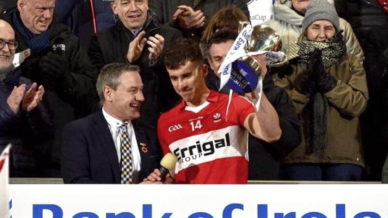 Derry captain Shane McGuigan receives the Dr McKenna Cup from Ulster GAA President Ciaran McLaughlin Picture: Philip Walsh