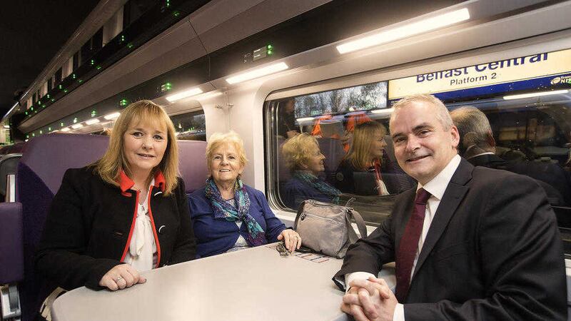 Minister Michelle McIlveen and Translink's Chris Conway with passenger Edna Murray&nbsp;