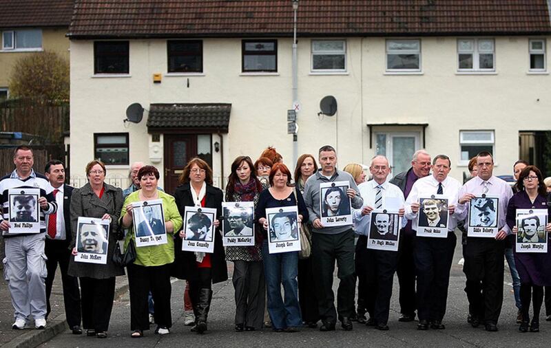 Relatives of those killed in the Ballymurphy Massacre hold photos of the victims&nbsp;