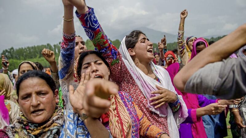 Kashmiri village women shout pro-Pakistani and pro-freedom slogans during the funeral procession of senior militant Arif Nabi Dar in Lilhar, about 35 kilometers (22 miles) south of Srinagar, Indian controlled Kashmir Picture: Dar Yasin/AP 