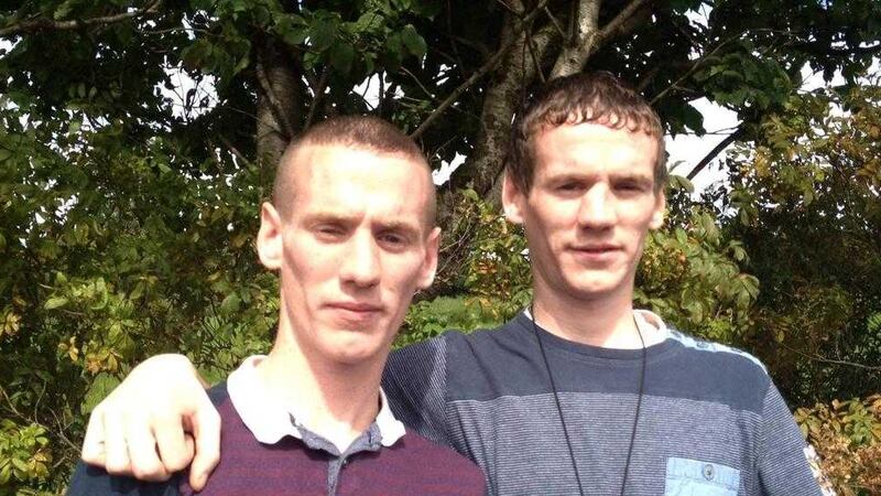 Murder victim Gerard Quinn, left, with his twin brother Michael who was also injured 