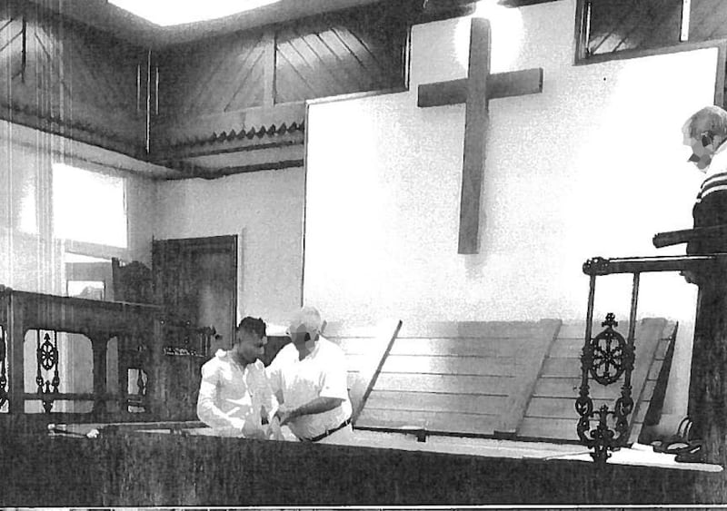 Abdul Ezedi (left) being baptised
