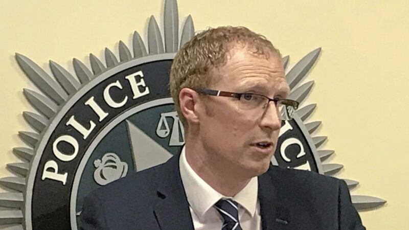 Detective Inspector Mark Bell gives the media an update on a human trafficking operation. Picture by Rebecca Black/PA 