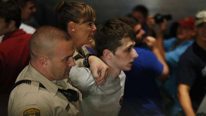 Police remove Michael Steven Sandford from a Donald Trump rally in Las Vegas last month PICTURE: John Locher/AP 