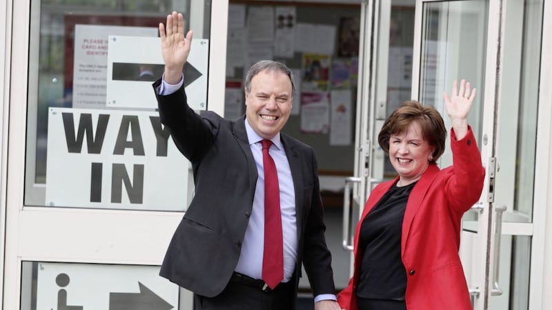Diane Dodds, with husband Nigel Dodds, arrives at Bannside Presbyterian Church in Banbridge to cast her vote for the European Parliament election in 2019. Photo: Brian Lawless/PA Wire. 