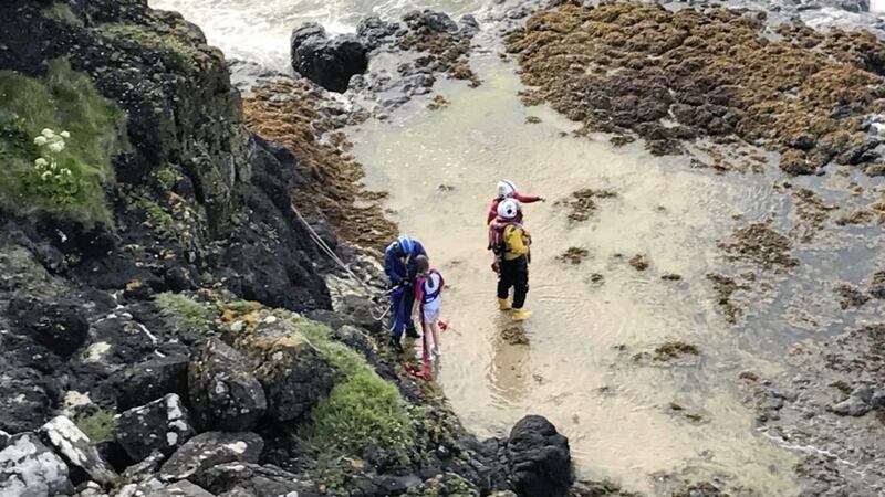The girl was sheltering on a rocky outcrop 100ft below a popular caravan park. Picture by Coleraine Coastguard 