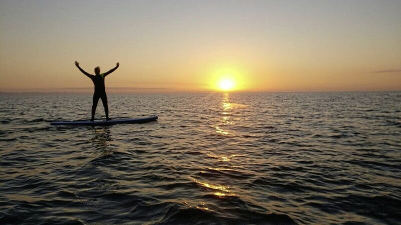 Try an early morning Stand Up Paddleboarding session at the foot of the Mourne Mountains 