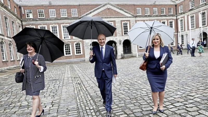Arlene Foster, then First Minister, Taoiseach Micheal Martin and Deputy First Minister Michelle O&#39;Neill at a North South Ministerial Council meeting in July last year 