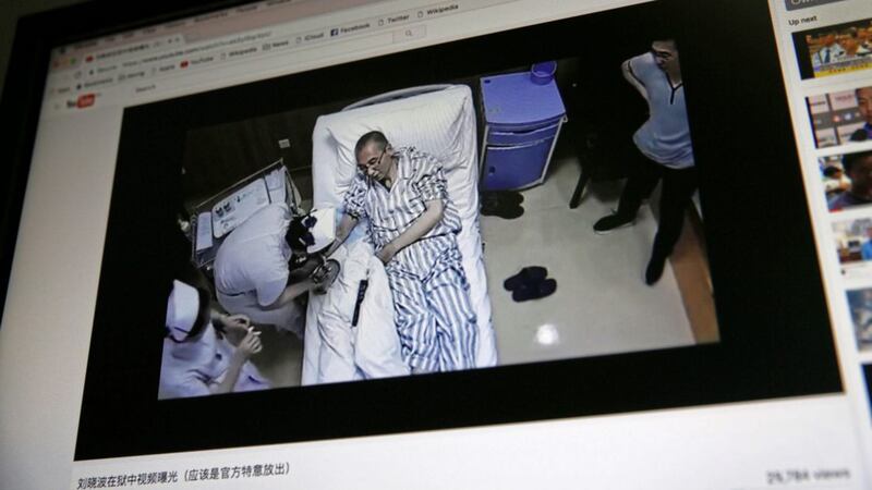 A video clip shows China&#39;s jailed Nobel Peace laureate Liu Xiaobo lying on a bed receiving medical treatment at a hospital on a computer screen in Beijing Picture: Andy Wong/AP 