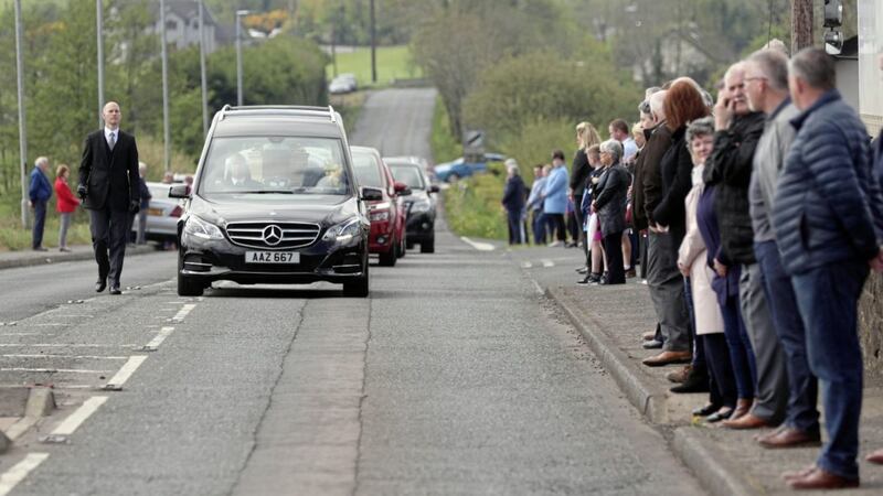 People line the road as the funeral cortege of SDLP MLA John Dallat arrives at St Mary&#39;s Church outside Kilrea. Picture by Stephen Davison/Pacemaker 