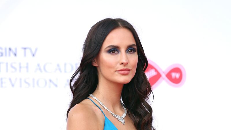 Lucy Watson said she is expecting her first child with partner James Dunmore (PA)
