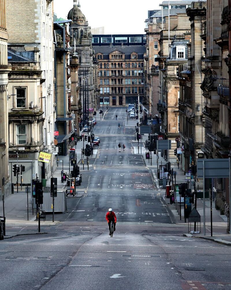 Cyclist on quiet Glasgow street