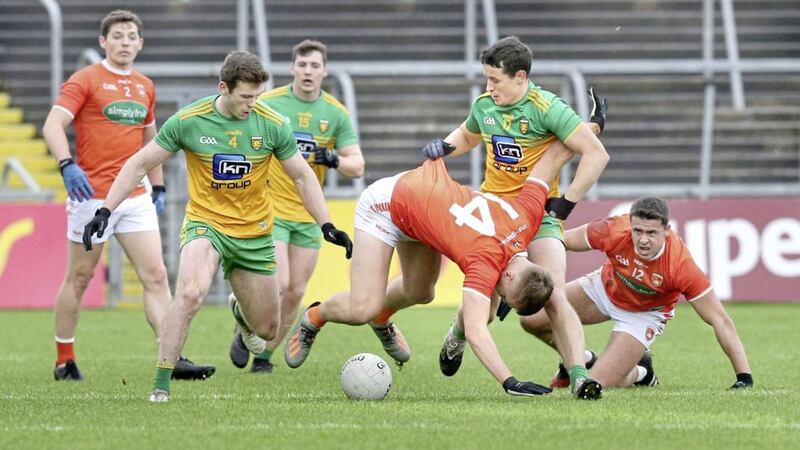 Donegal&#39;s Eoghan Ban Gallagher has his eyes on the ball as Eoin McHugh tussles with Armagh&#39;s Rian O&#39;Neill during the Ulster SFC semi-final on Saturday November 14 2020 at Breffni Park, Cavan. Picture by Margaret McLaughlin 