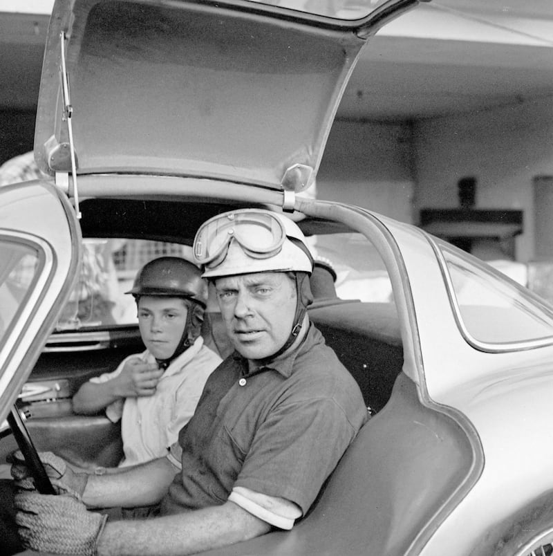 Rudolf Uhlenhaut and his son Roger in a Mercedes-Benz 300 SLR during test runs on the Monza race track in Italy in August 1955. The same car travelled to Dundrod in Co Antrim to help drivers including Juan Manuel Fangio and Stirling Moss prepare for the RAC Tourist Trophy race in September 1955. 