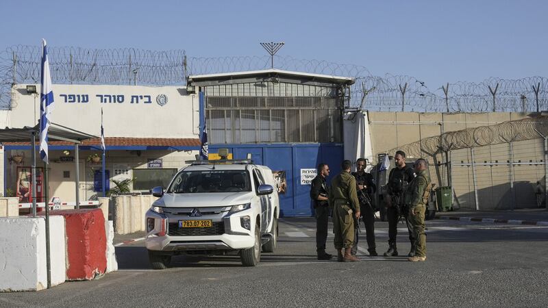 Israeli soldiers stand outside Ofer military prison near Jerusalem ahead of the hostage/prisoner exchanges (Mahmoud Illean/AP/PA)