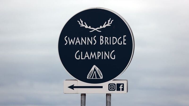 &nbsp;A sign for the Swanns Bridge Glamping site near near Limavady in Co Derry where a 37-year-old woman was stabbed to death on Monday July 12. A 53-year-old man has been arrested and police said both the victim and the suspect were holidaymakers
