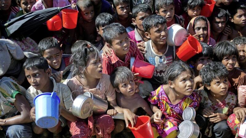 Rohingya Muslim children, who crossed over from Myanmar into Bangladesh, wait squashed against each other to receive food handouts distributed to children and women by a Turkish aid agency at the Thaingkhali refugee camp in Ukhiya, Bangladesh, on Tuesday. Picture by AM Ahad, Press Association 