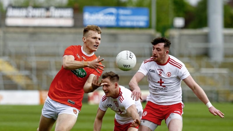 Armagh's Rian O'Neill eludes the Tyrone duo of future Footballer of the Year Kieran McGeary and Rory Brennan during last year's Division One North clash.<br /> Pic Philip Walsh