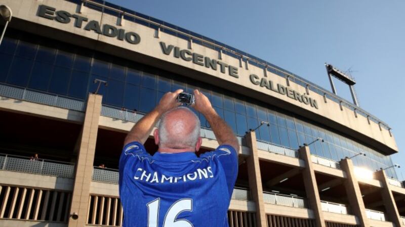 A Leicester City fan takes a photo of the Vicente Calderon