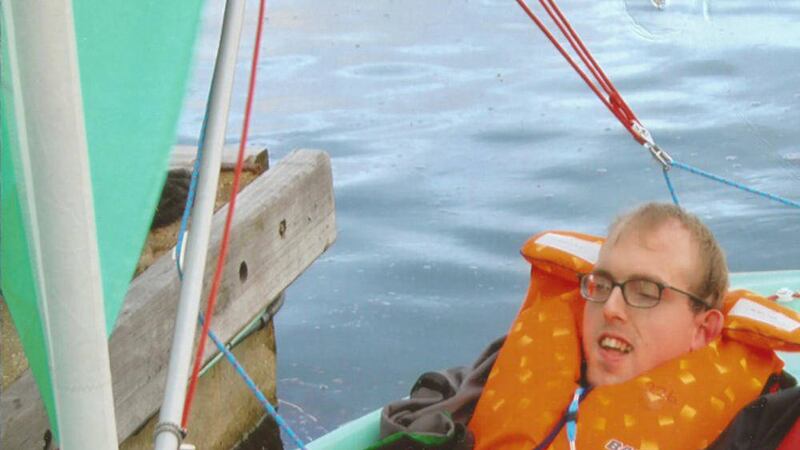 A pupil of the Lighthouse Trust summer school learns to sail in Donaghadee 