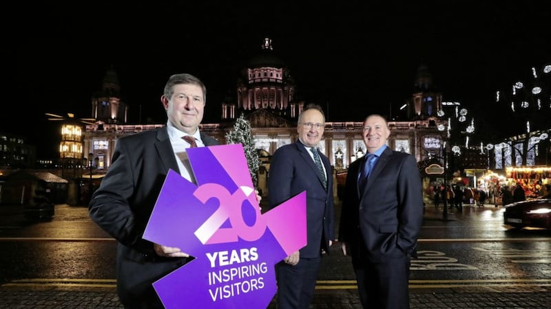 Visit Belfast chair Michael Williamson (left), chief executive Gerry Lennon (right) and outgoing chair Dr Howard Hastings (who will remain on the board) 