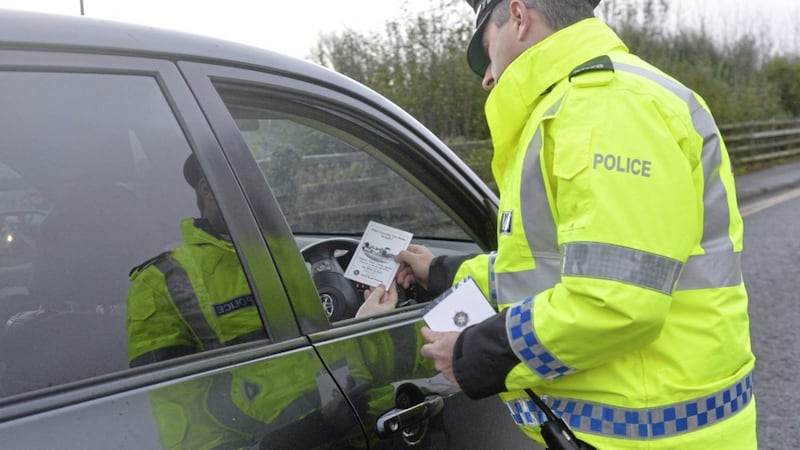 Police hand out leaflets to motorists in 2015 to launch their winter operation against drink and drug-driving 